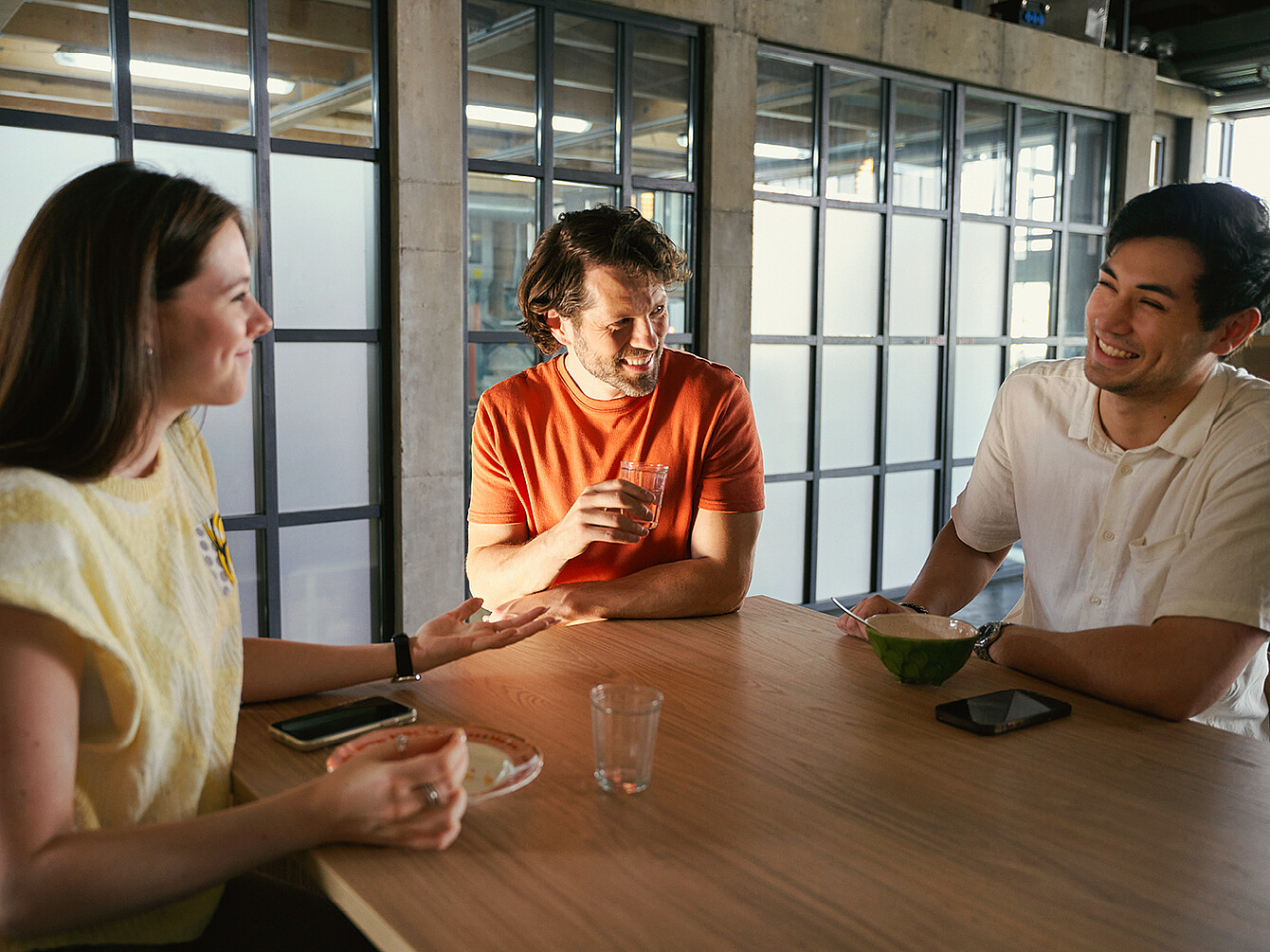 Three colleagues are talking