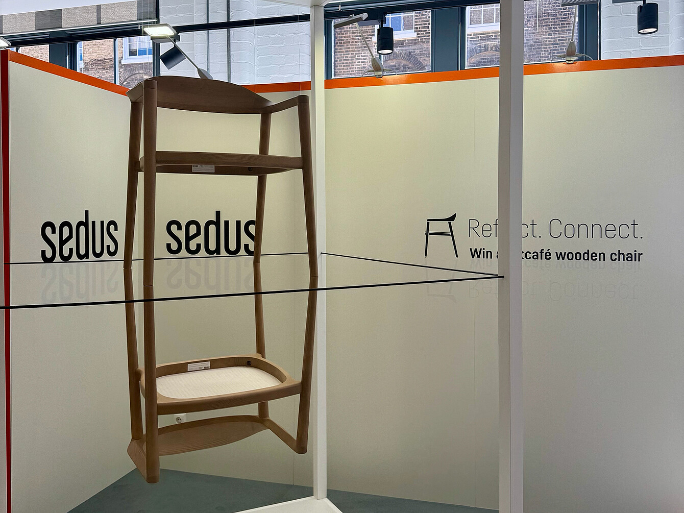 two se:cafe wooden chairs as an installation on top of each other