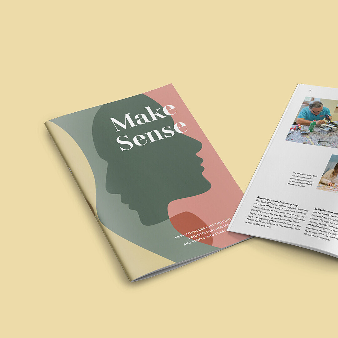 Booklet titled 'Make Sense' with a silhouette profile on the cover, open to pages showing photos of people working on crafts and a landscape with buildings and gardens, accompanied by text.