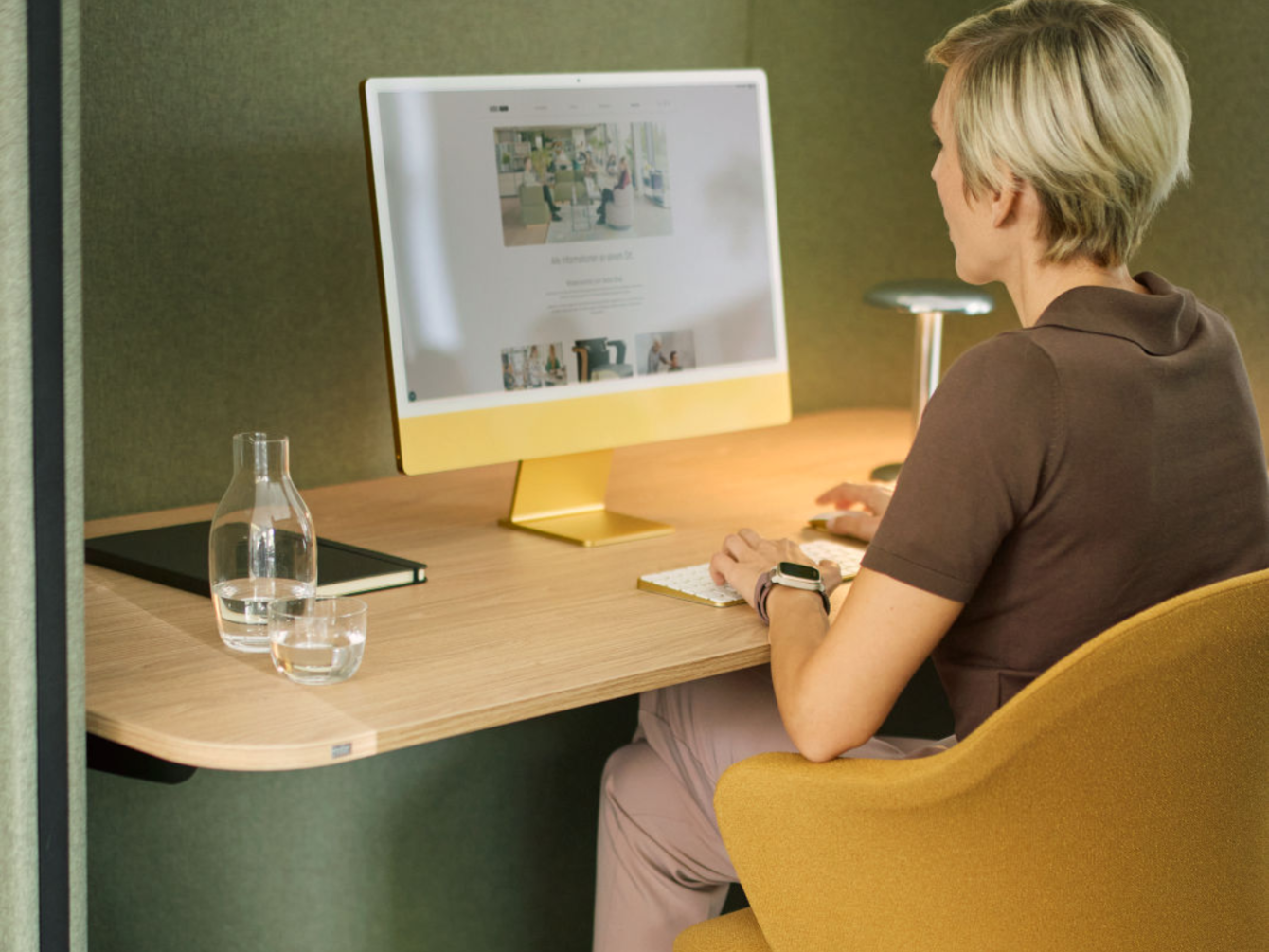 Woman sitting at her desk, concentrating 